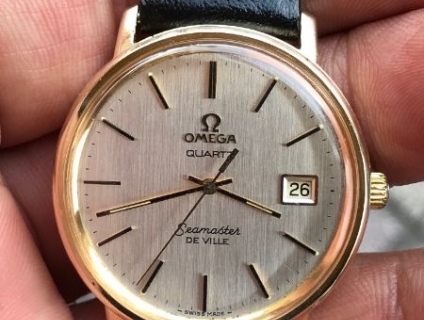 kính phố đồng hồ Omega pin võ vàng đúc 14, chánh hãng Thụy sĩ