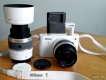 Cần tiền, bán trọn bộ Nikon J1 full lens mới mua