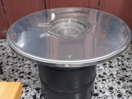 Bàn ăn lẩu nướng thùng phuy mặt inox cho nhà hàng tại Hà Nội