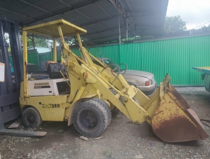 xe xúc lật hàng  nghĩa địa